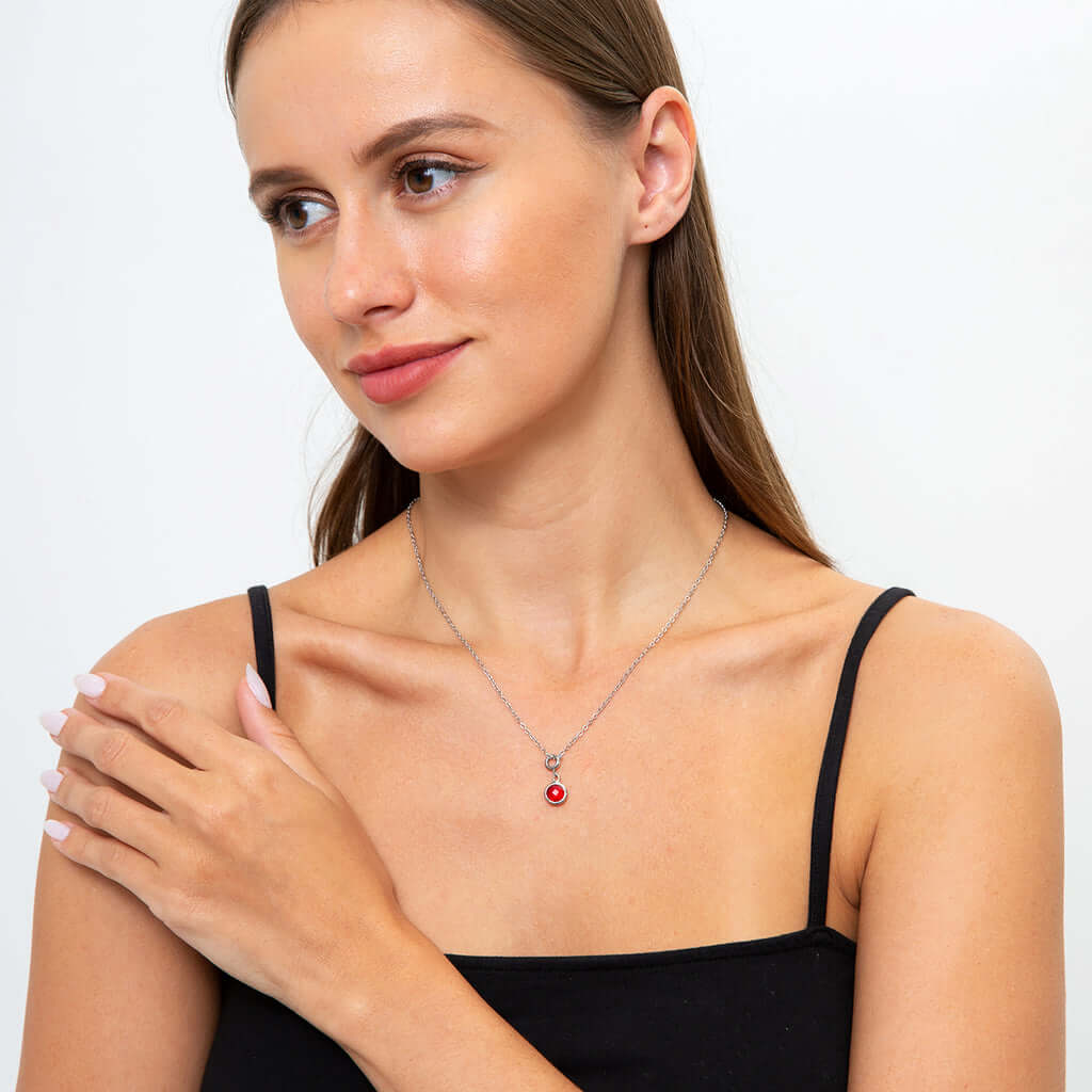 Congrats to the Grad - Birthstone NecklaceA minimalist birthstone necklace that incorporates the color of each birth month from Mom and Dad for graduation. Perfect gift for the perfect event.Moving Phrases