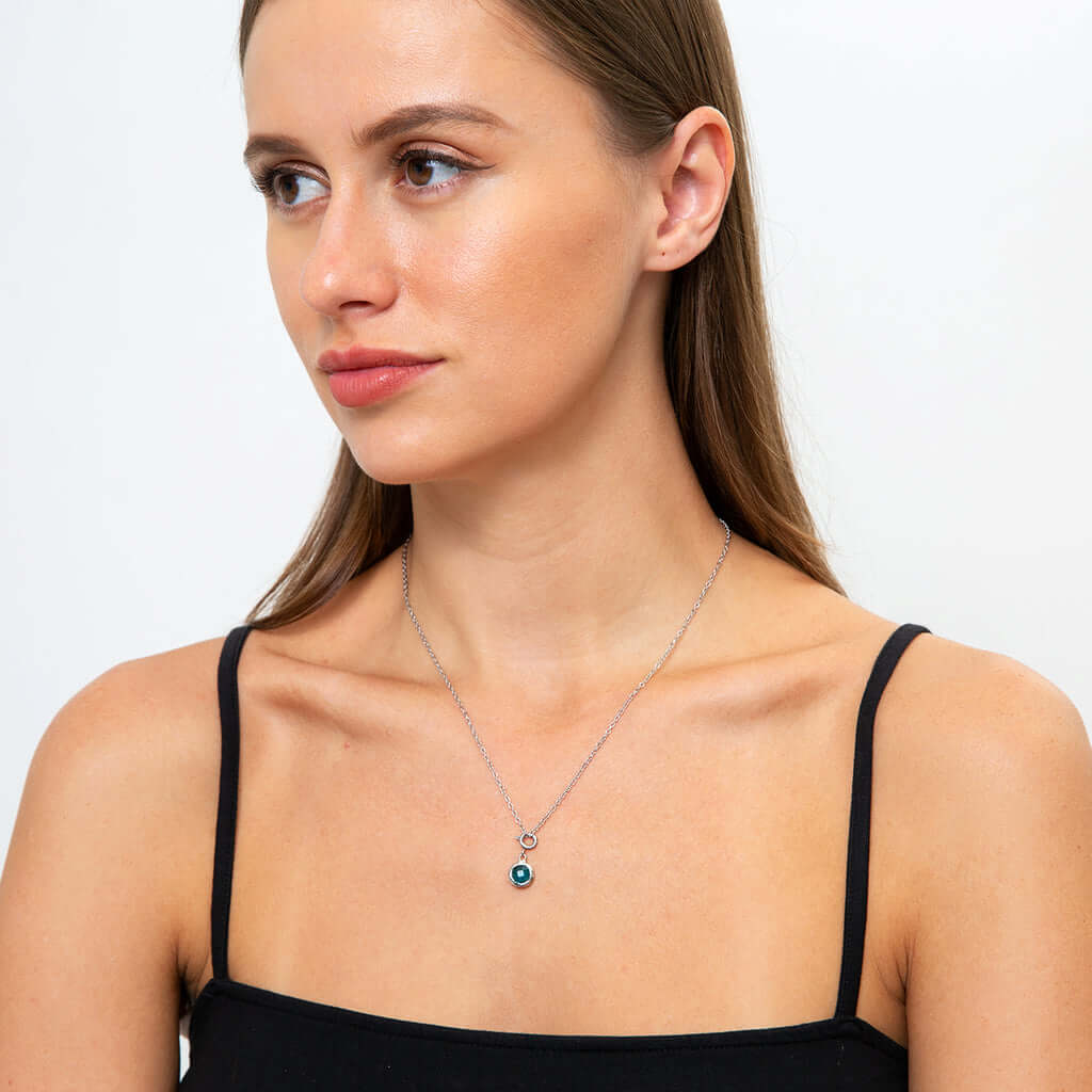 Congrats to the Grad - Birthstone NecklaceA minimalist birthstone necklace that incorporates the color of each birth month from Mom and Dad for graduation. Perfect gift for the perfect event.Moving Phrases