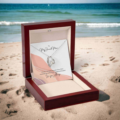 To My Dearest Mom, I am who I am - Love Knot Necklace"Mom, your guidance made me who I am. The Forever Love Necklace with a 6.5mm CZ crystal in a heart pendant is a symbol of my love."Moving Phrases