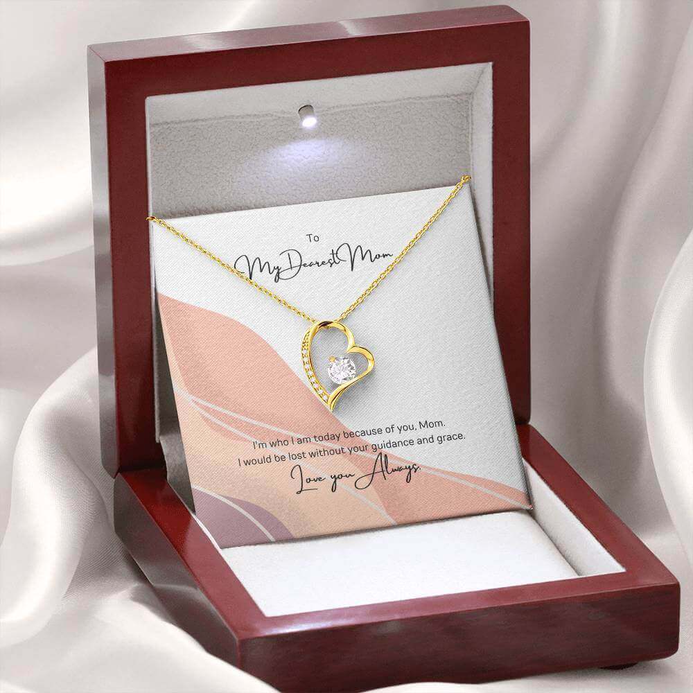 To My Dearest Mom, I am who I am - Love Knot Necklace"Mom, your guidance made me who I am. The Forever Love Necklace with a 6.5mm CZ crystal in a heart pendant is a symbol of my love."Moving Phrases