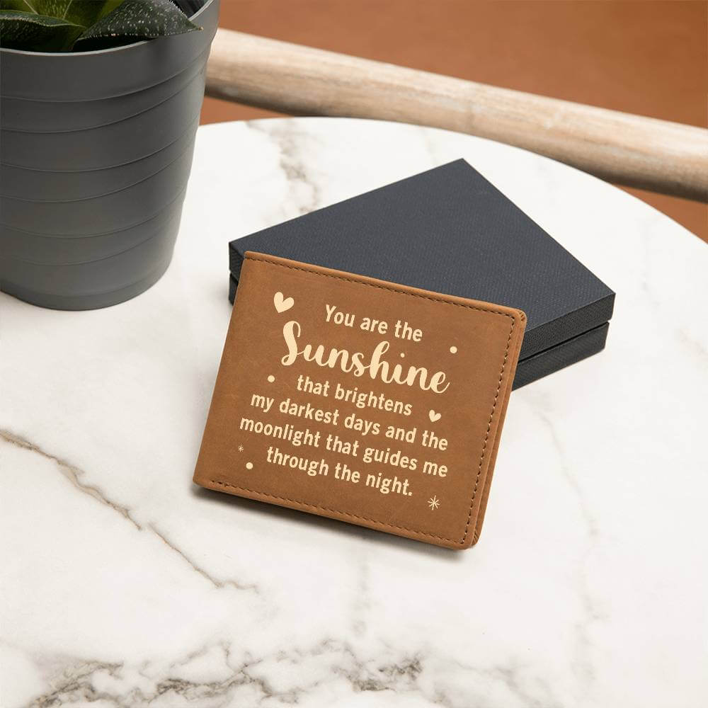 You are the Sunshine - Graphic Leather WalletGift a quality Graphic Leather Wallet! Made from full grain cowhide, it ages beautifully. Comes in a stylish gift box.Moving Phrases