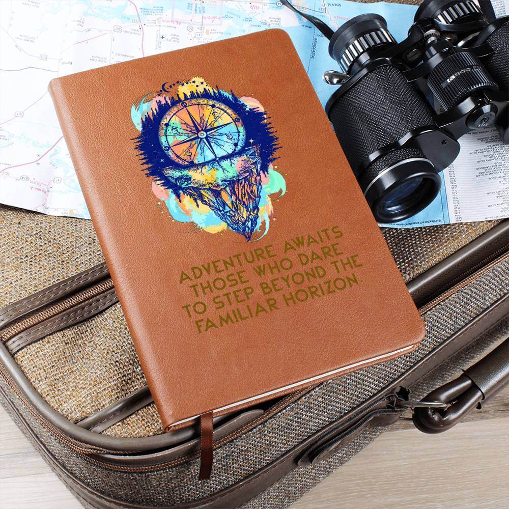 Adventure Awaits - Graphic Leather JournalVenture beyond with the Graphic Leather Journal. Ideal for goal setting and organization, it features a bookmark and elastic closure.Moving Phrases