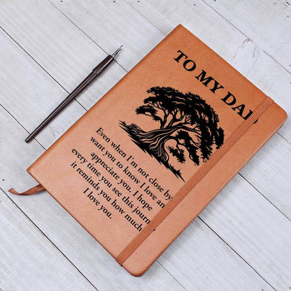 To My Dad, Even when I'm not close - Graphic Leather JournalVenture beyond with the Graphic Leather Journal. Ideal for goal setting and organization, it features a bookmark and elastic closure.Moving Phrases