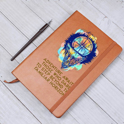 Adventure Awaits - Graphic Leather JournalVenture beyond with the Graphic Leather Journal. Ideal for goal setting and organization, it features a bookmark and elastic closure.Moving Phrases