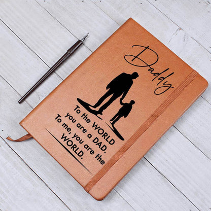 Daddy, to the World you are a Dad - Graphic Leather JournalVenture beyond with the Graphic Leather Journal. Ideal for goal setting and organization, it features a bookmark and elastic closure.Moving Phrases