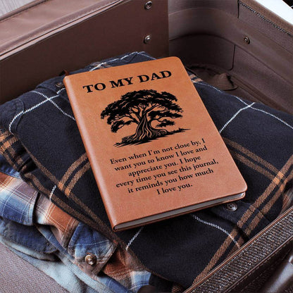 To My Dad, Even when I'm not close - Graphic Leather JournalVenture beyond with the Graphic Leather Journal. Ideal for goal setting and organization, it features a bookmark and elastic closure.Moving Phrases