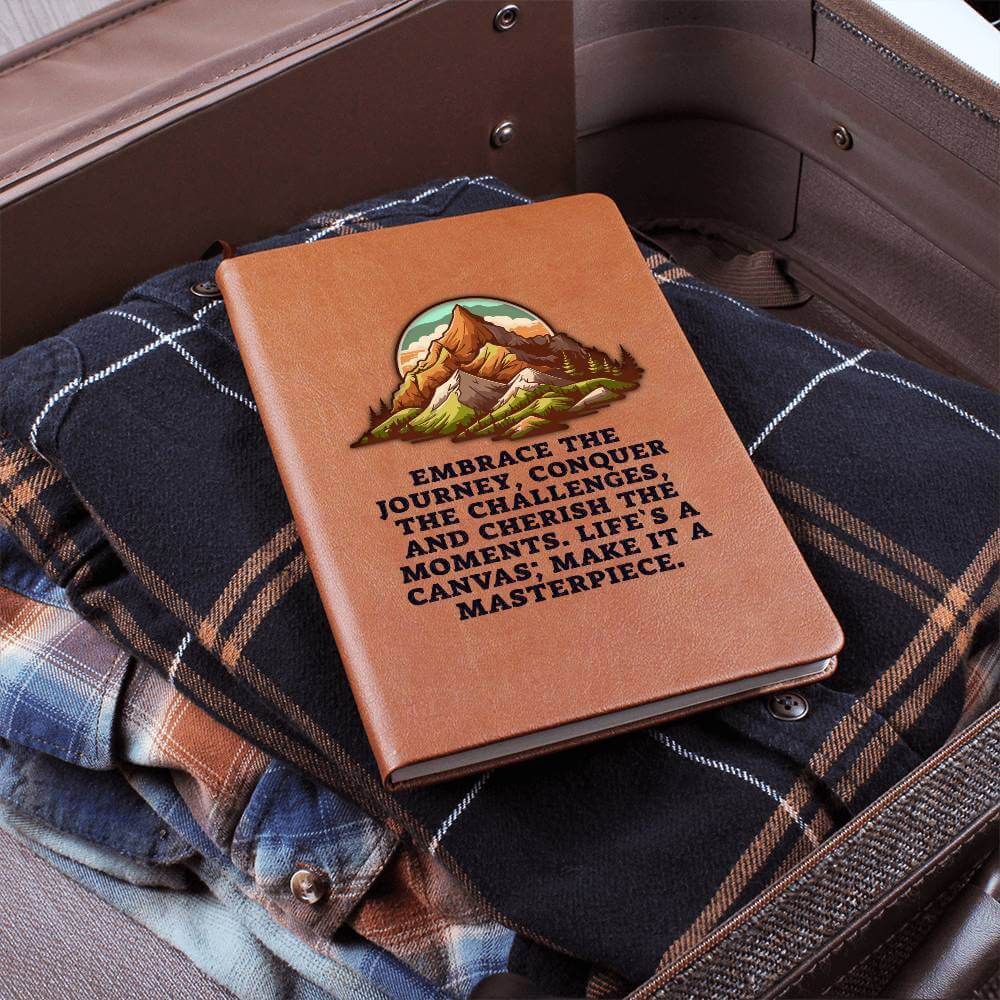 Embrace the journey - Graphic Leather JournalVenture beyond with the Graphic Leather Journal. Ideal for goal setting and organization, it features a bookmark and elastic closure.Moving Phrases