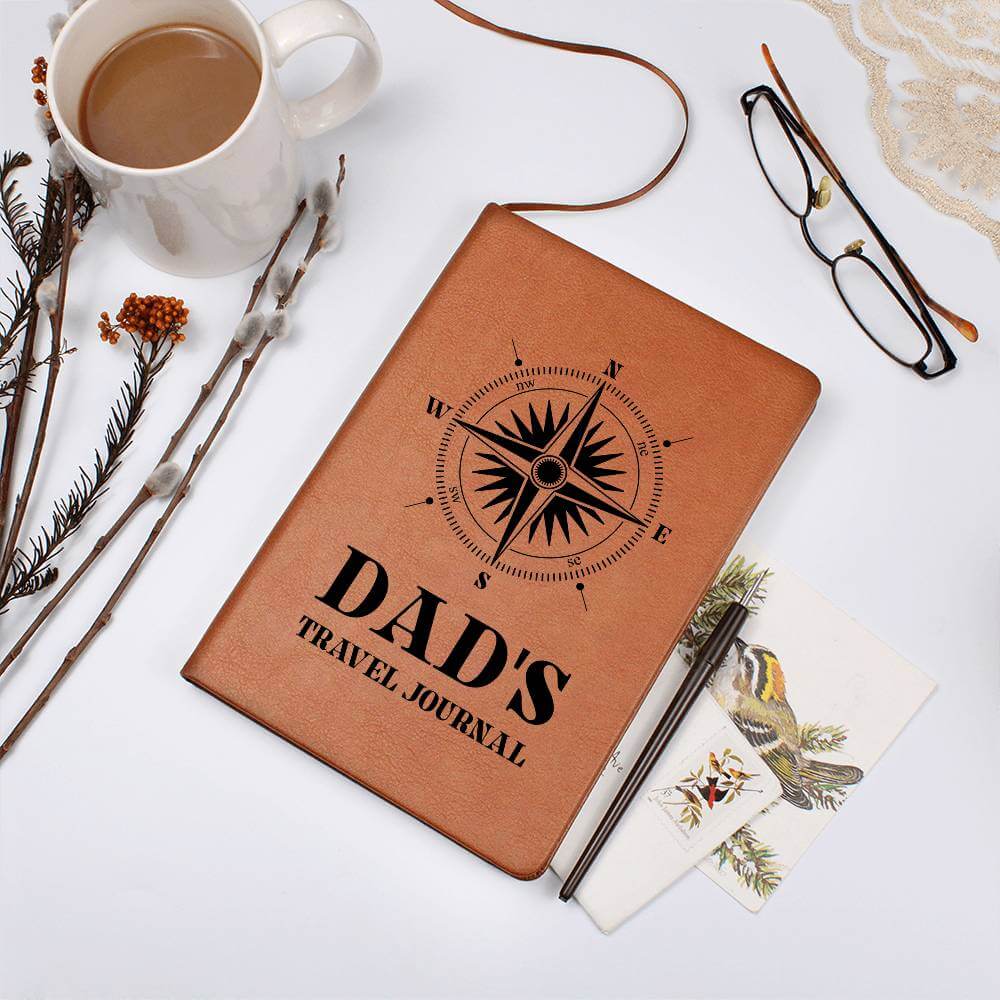 Dad's Travel Journal - Graphic Leather JournalVenture beyond with the Graphic Leather Journal. Ideal for goal setting and organization, it features a bookmark and elastic closure.Moving Phrases