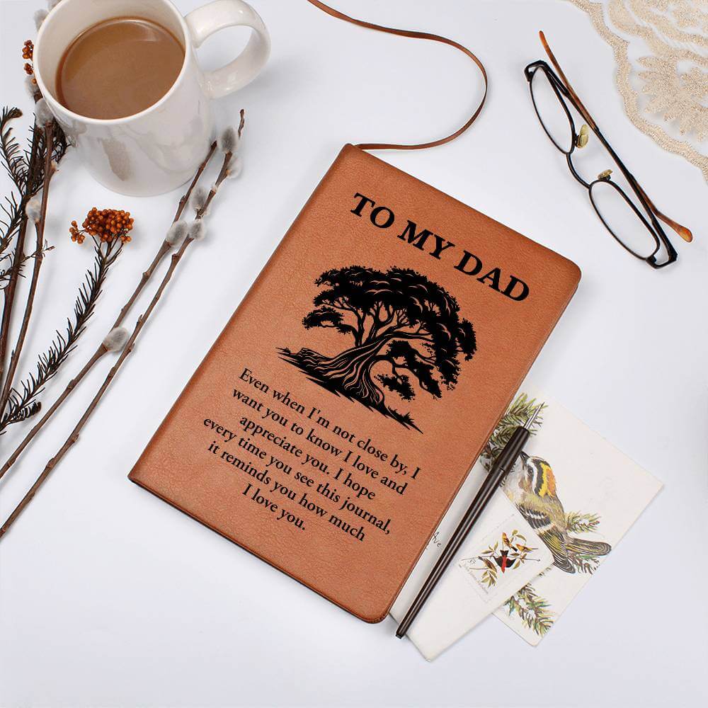 To My Dad, Even when I'm not close - Graphic Leather JournalVenture beyond with the Graphic Leather Journal. Ideal for goal setting and organization, it features a bookmark and elastic closure.Moving Phrases