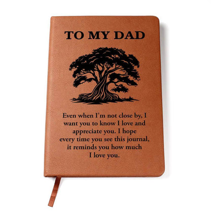 To My Dad, Even when I'm not close - Graphic Leather JournalVenture beyond with the Graphic Leather Journal. Ideal for goal setting and organization, it features a bookmark and elastic closure.Moving Phrases