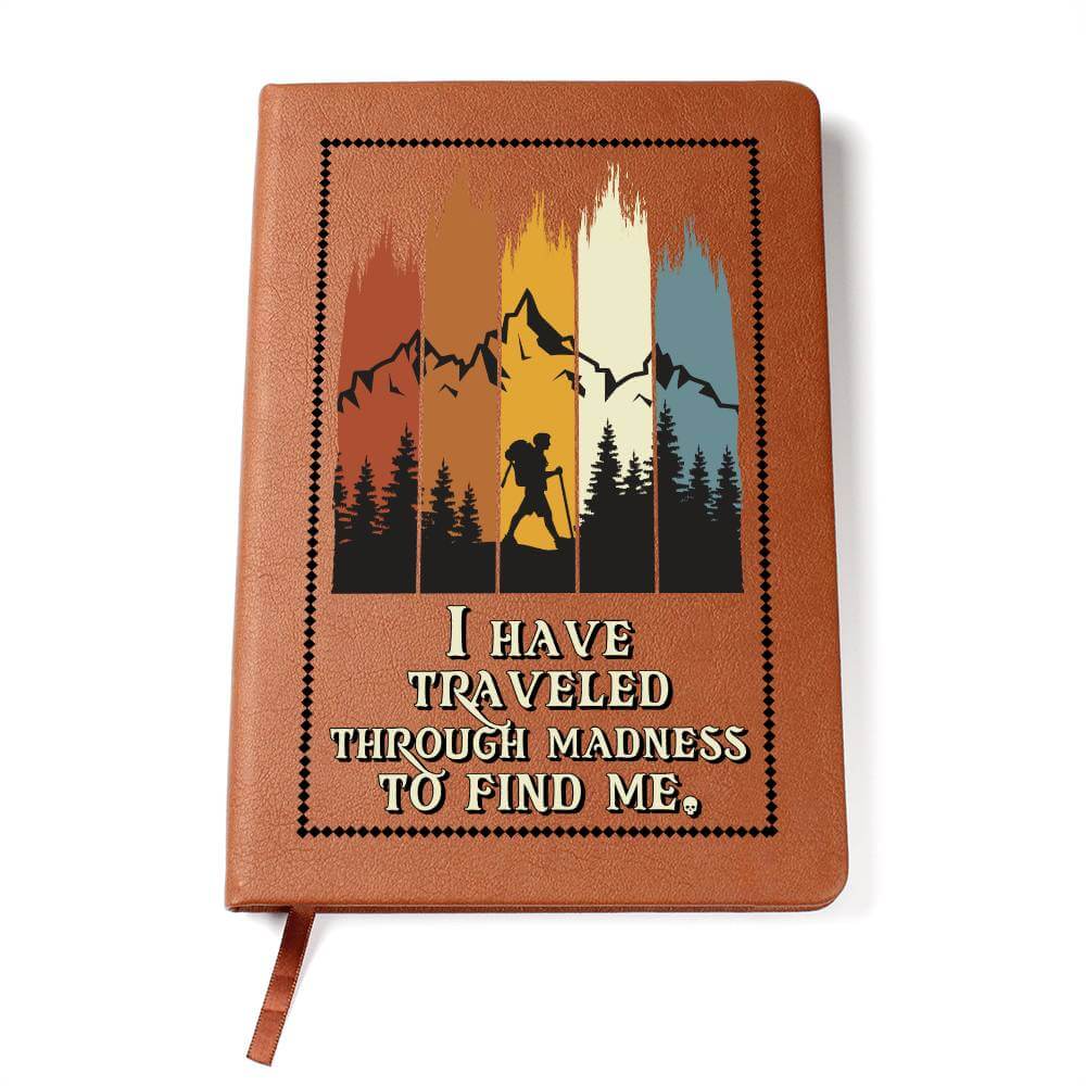 I have traveled through madness - Graphic Leather JournalVenture beyond with the Graphic Leather Journal. Ideal for goal setting and organization, it features a bookmark and elastic closure.Moving Phrases