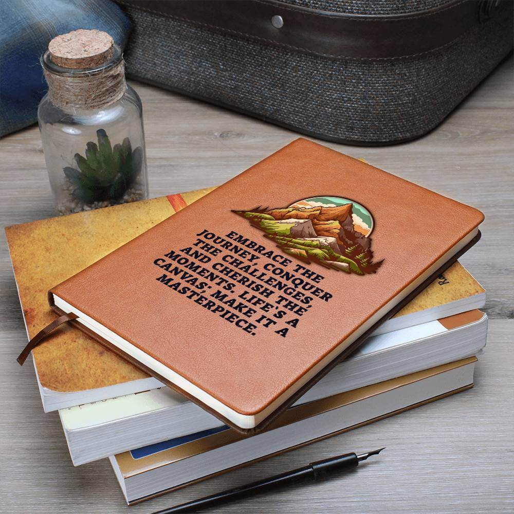 Embrace the journey - Graphic Leather JournalVenture beyond with the Graphic Leather Journal. Ideal for goal setting and organization, it features a bookmark and elastic closure.Moving Phrases