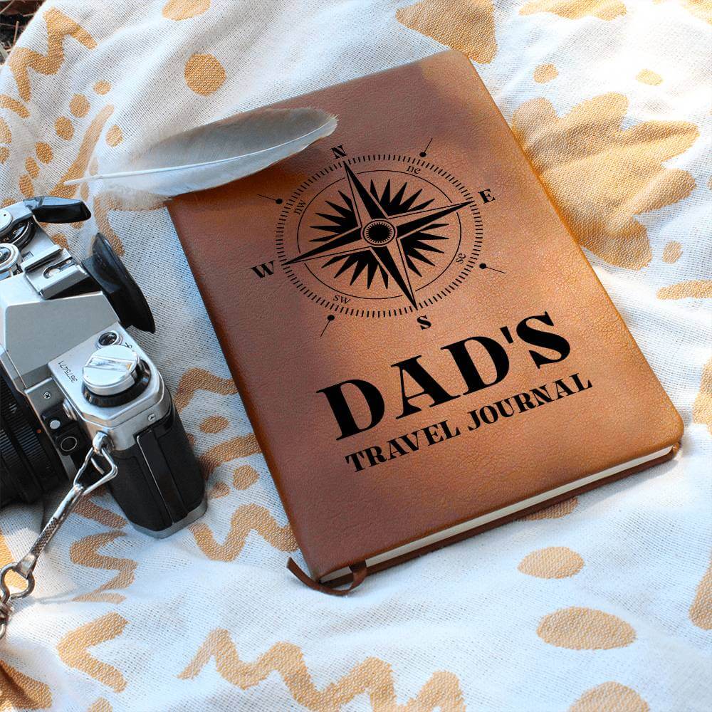 Dad's Travel Journal - Graphic Leather JournalVenture beyond with the Graphic Leather Journal. Ideal for goal setting and organization, it features a bookmark and elastic closure.Moving Phrases