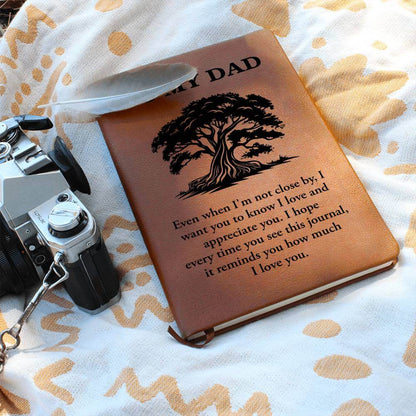 To My Dad, Even when I'm not close - Graphic Leather JournalVenture beyond with the Graphic Leather Journal. Ideal for goal setting and organization, it features a bookmark and elastic closure.Moving Phrases