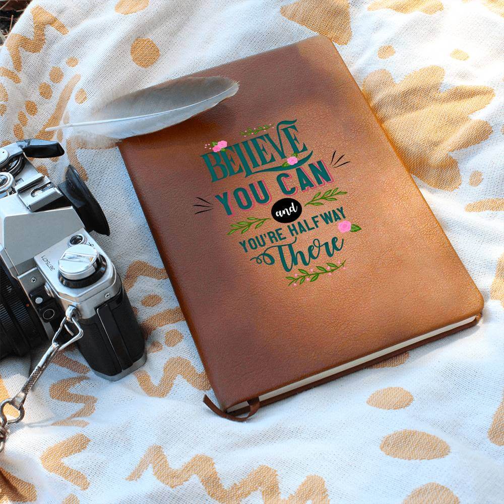 Believe you can - Graphic Leather JournalVenture beyond with the Graphic Leather Journal. Ideal for goal setting and organization, it features a bookmark and elastic closure.Moving Phrases