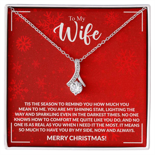 Elegant silver necklace on a festive red card with a heartfelt Christmas message for a wife, highlighting love and appreciation.