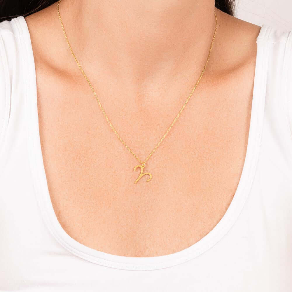 Aries Zodiac Symbol NecklaceImagine her smile when you give her this Zodiac Symbol Necklace. Handcrafted with care, this piece is made from durable stainless steel and optionally dipped in 18k yellow gold and features her unique astrological sign. This wo