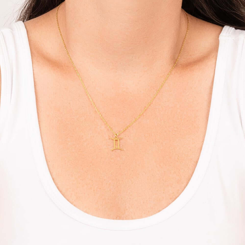 Gemini Zodiac Symbol NecklaceImagine her smile when you give her this Zodiac Name Necklace. Handcrafted with care, this piece is made from durable stainless steel and optionally dipped in 18k yellow gold and features her unique astrological sign. This wou