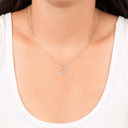 Cancer Zodiac Symbol NecklaceImagine her smile when you give her this Zodiac Name Necklace. Handcrafted with care, this piece is made from durable stainless steel and optionally dipped in 18k yellow gold and features her unique astrological sign. This wou