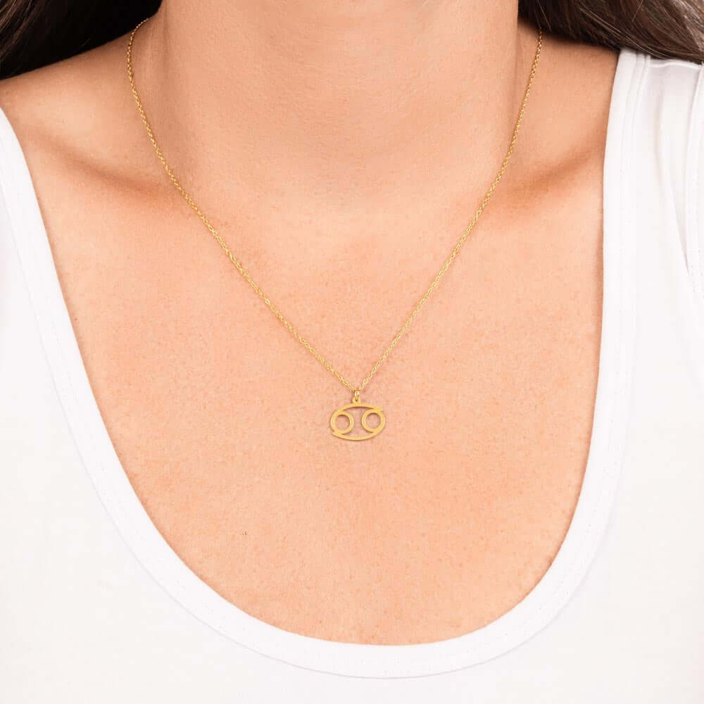 Cancer Zodiac Symbol NecklaceImagine her smile when you give her this Zodiac Name Necklace. Handcrafted with care, this piece is made from durable stainless steel and optionally dipped in 18k yellow gold and features her unique astrological sign. This wou