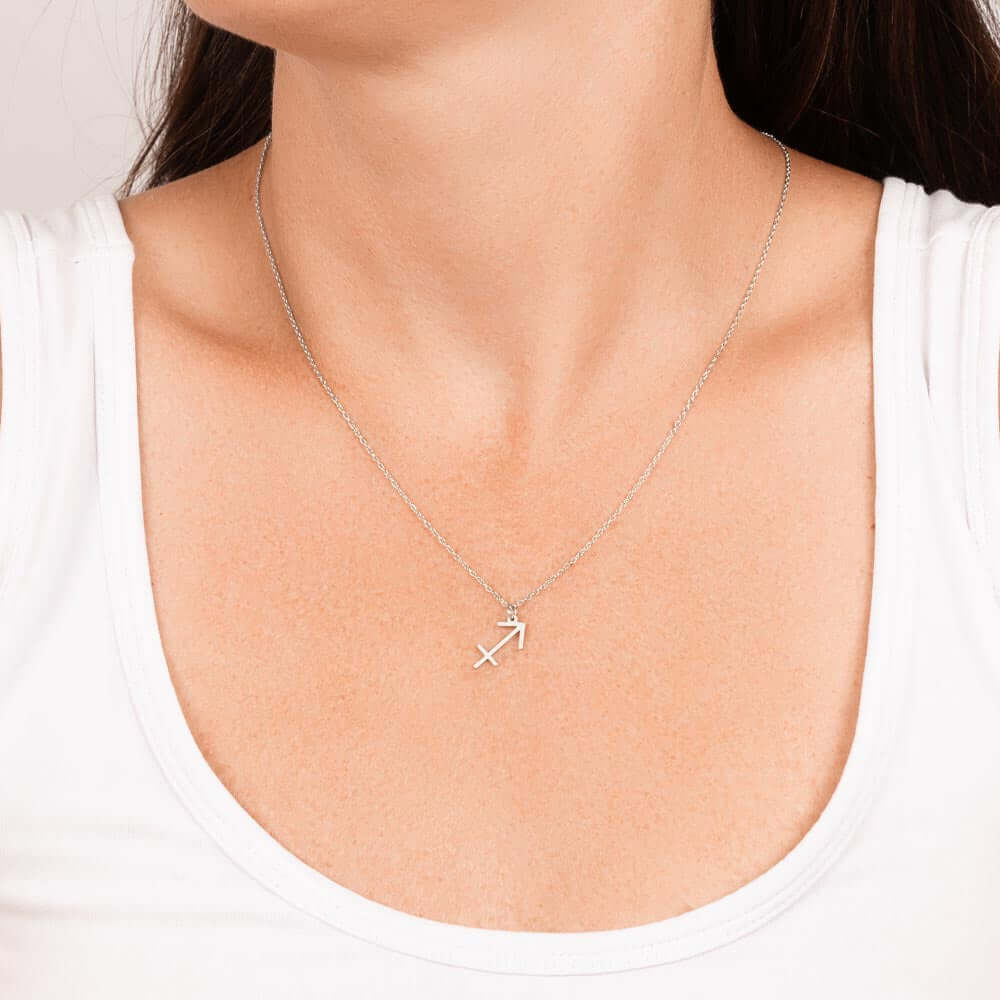 Sagittarius Zodiac Symbol NecklaceImagine her smile when you give her this Zodiac Symbol Necklace. Handcrafted with care, this piece is made from durable stainless steel and optionally dipped in 18k yellow gold and features her unique astrological sign. T