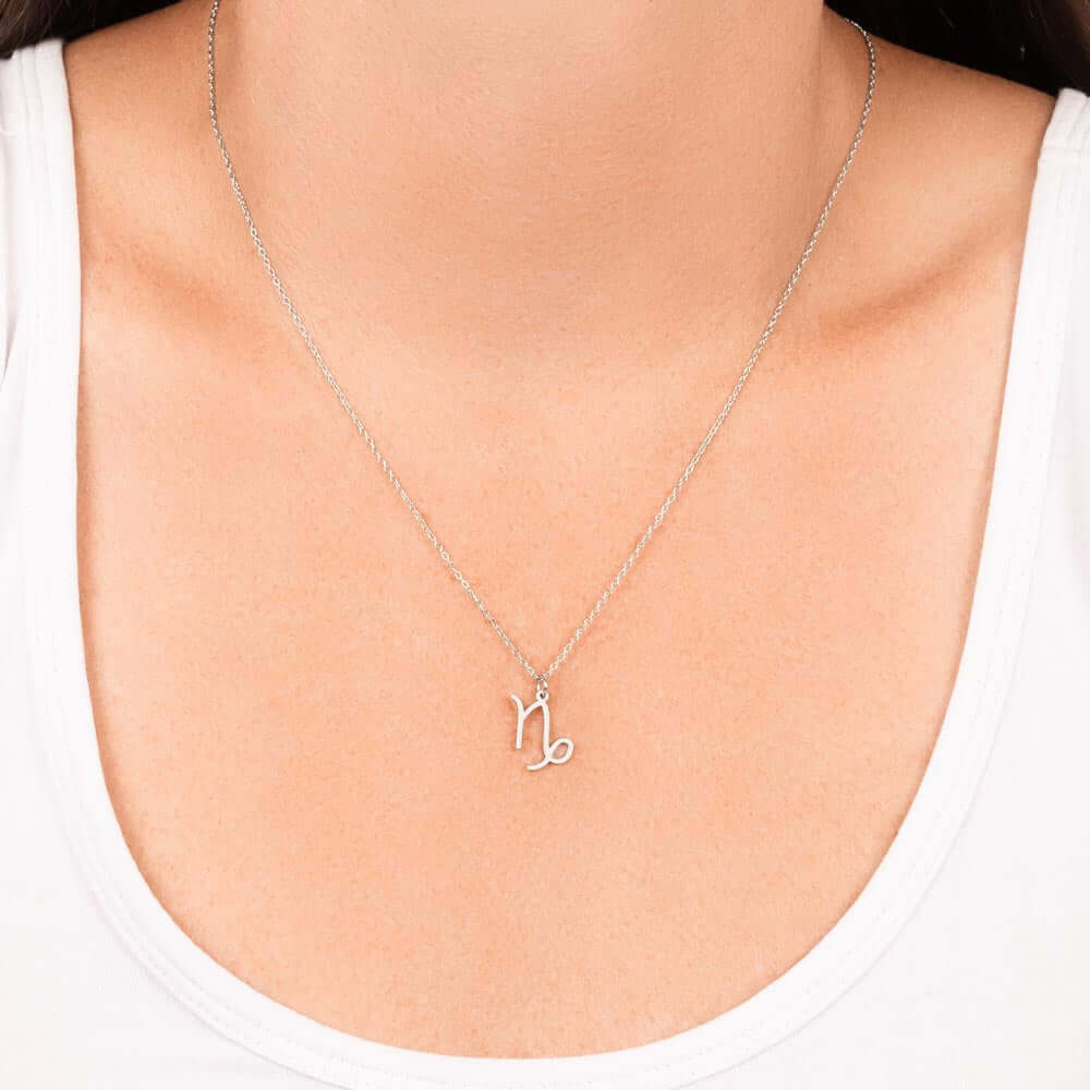 Capricorn Zodiac Symbol NecklaceImagine her smile when you give her this Zodiac Symbol Necklace. Handcrafted with care, this piece is made from durable stainless steel and optionally dipped in 18k yellow gold and features her unique astrological sign. Thi