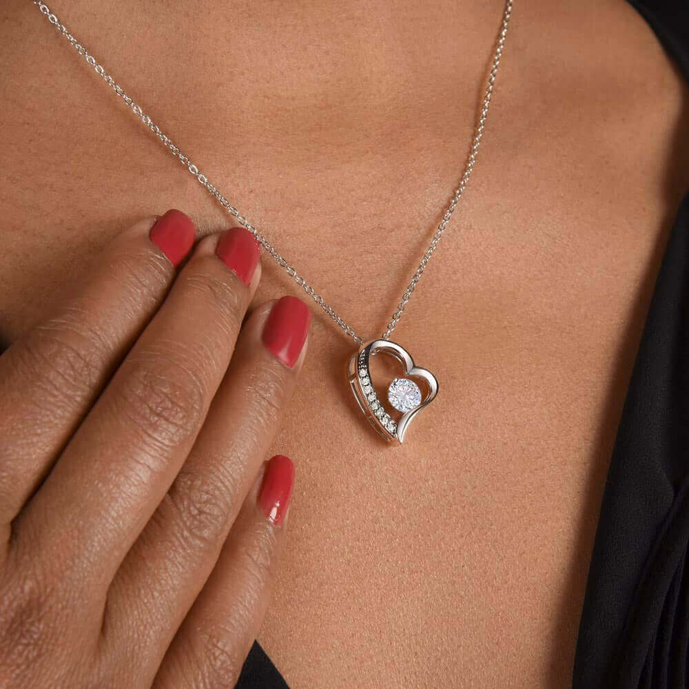 To My Dearest Mom, I am who I am - Love Knot Necklace"Mom, your guidance made me who I am. The Forever Love Necklace with a 6.5mm CZ crystal in a heart pendant is a symbol of my love."Moving Phrases