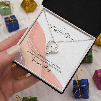 To My Dearest Mom, I am who I am - Love Knot Necklace"Mom, your guidance made me who I am. The Forever Love Necklace with a 6.5mm CZ crystal in a heart pendant is a symbol of my love."Moving Phrases