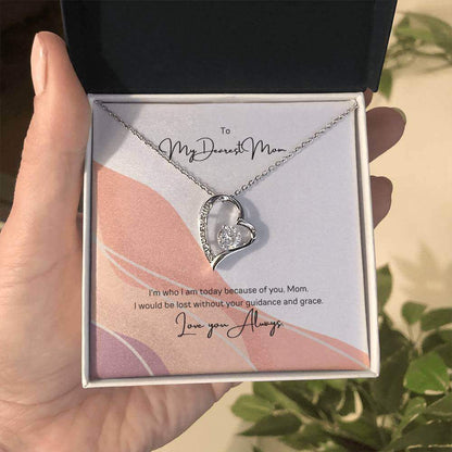 To My Dearest Mom, I am who I am - Love Knot Necklace"Mom, your guidance made me who I am. The Forever Love Necklace with a 6.5mm CZ crystal in a heart pendant is a symbol of my love."Moving Phrases