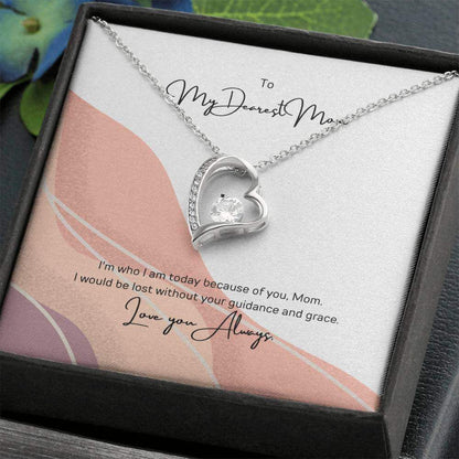 To My Dearest Mom, I am who I am - Love Knot Necklace"Mom, your guidance made me who I am. The Forever Love Necklace with a 6.5mm CZ crystal in a heart pendant is a symbol of my love."Moving Phrases