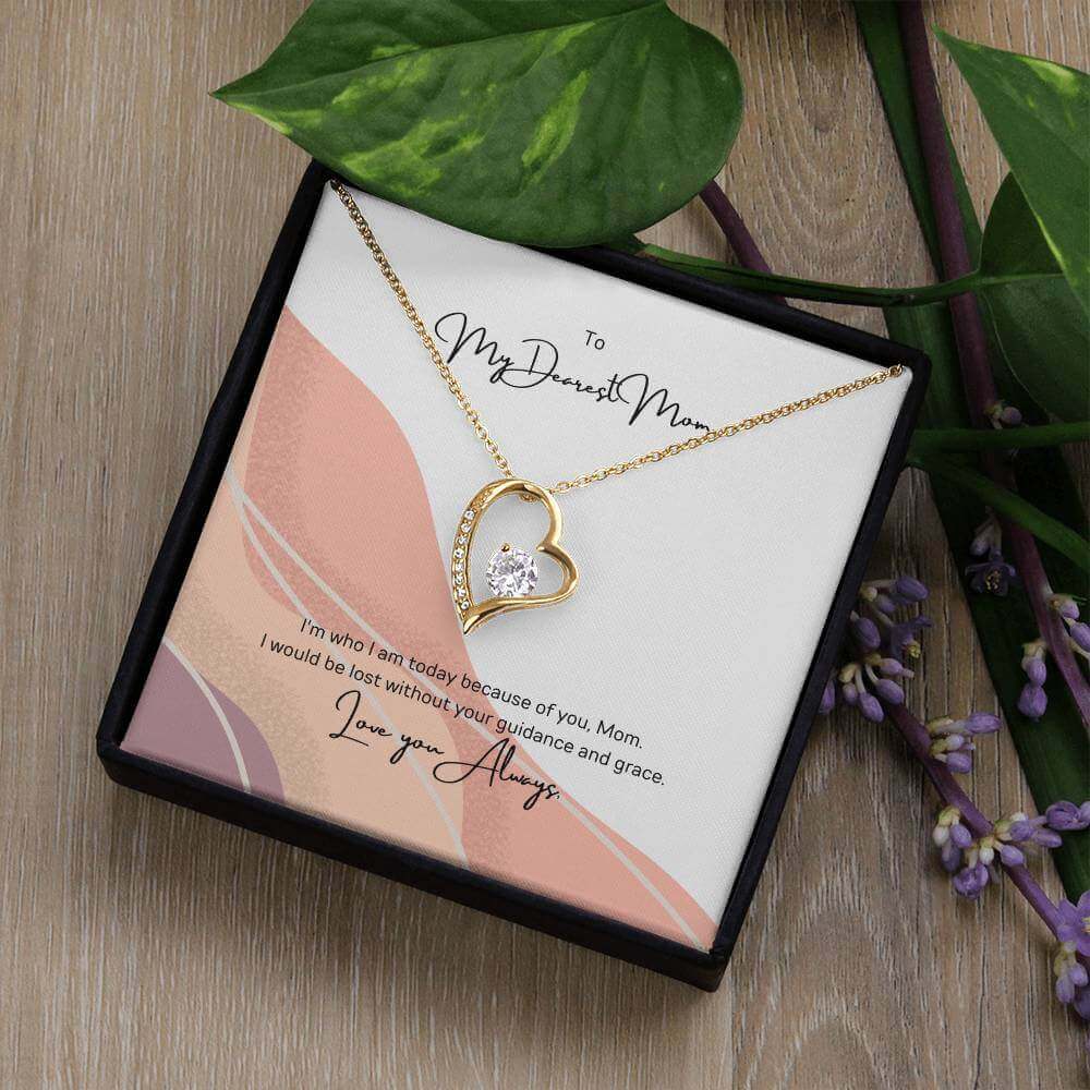 To My Dearest Mom, I am who I am - Love Knot Necklace"Mom, your guidance made me who I am. The Forever Love Necklace with a 6.5mm CZ crystal in a heart pendant is a symbol of my love."Moving Phrases